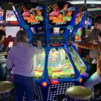 Alumni playing the Coin Drop game